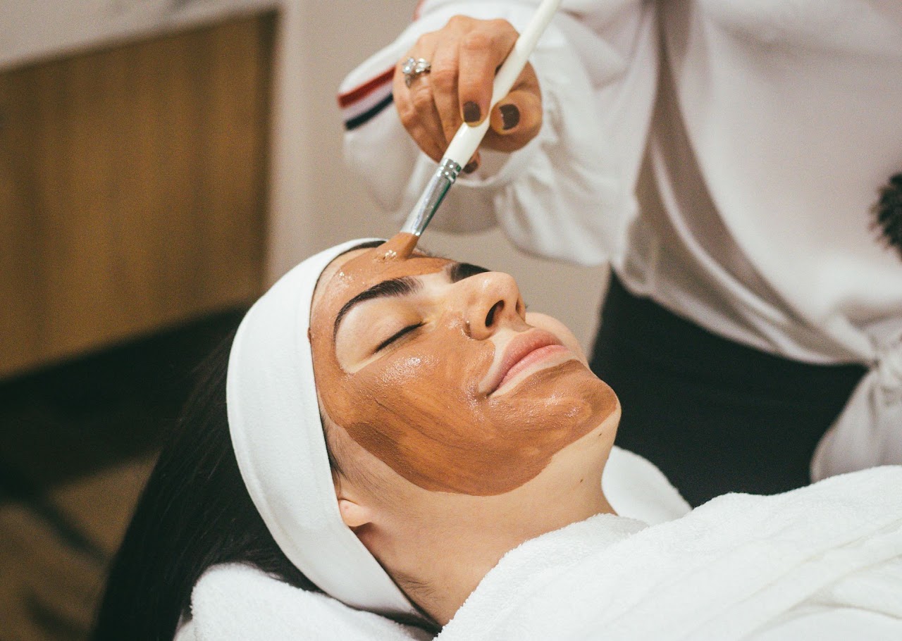 A facial mask being applied during a treatment